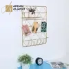 ديكور رف معلق ذهبي بهيكل معدني