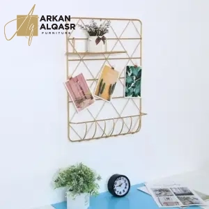 ديكور رف معلق ذهبي بهيكل معدني